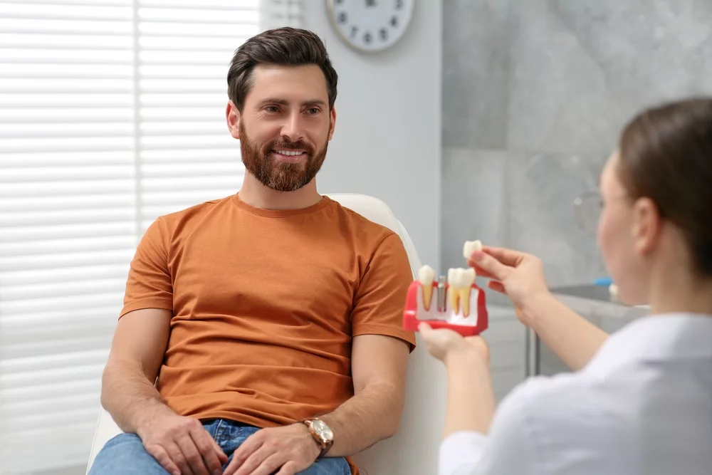 Dentist explaining how implants heal