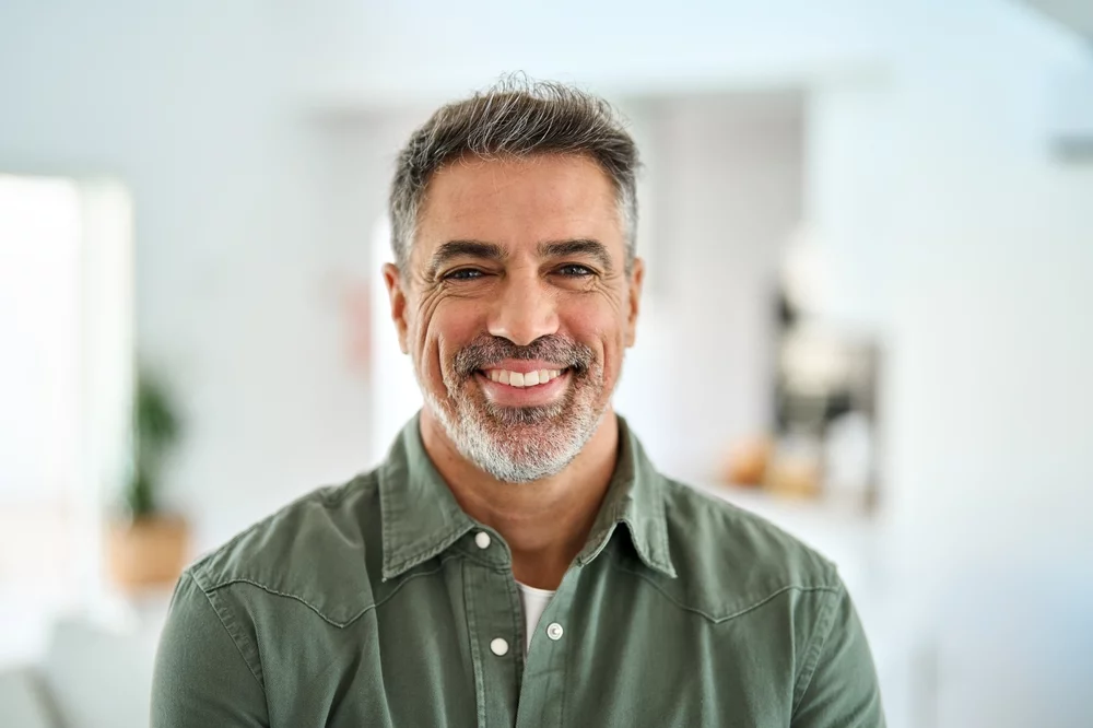 Middle-aged man smiling at the camera